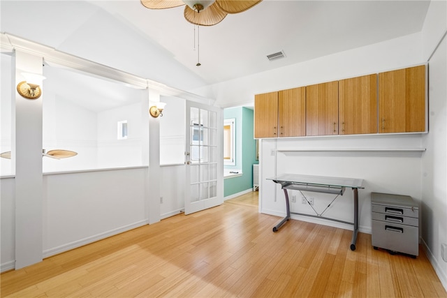 kitchen with ceiling fan, light wood-type flooring, and lofted ceiling