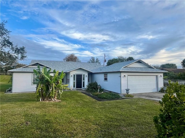 ranch-style house with a front lawn and a garage