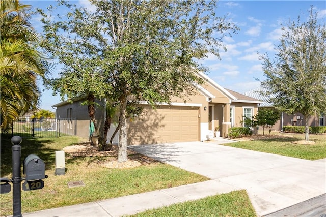 view of front of house featuring a garage and a front yard