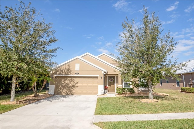 view of front of home with a garage and a front lawn