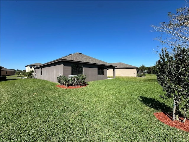 4131 Keeson Cir, Vero Beach, FL 32967 - rear view of property with a yard