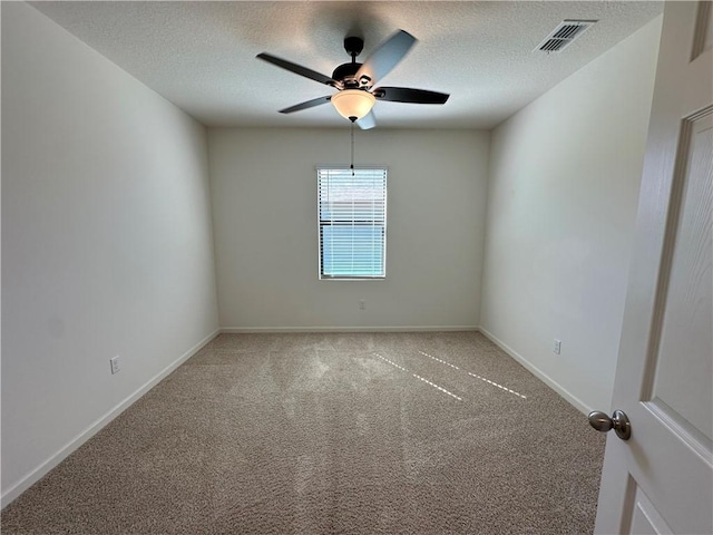4131 Keeson Cir, Vero Beach, FL 32967 - empty room featuring a ceiling fan, a textured ceiling, and carpet floors