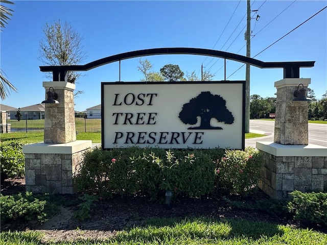 community sign with fence