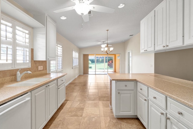 kitchen featuring white cabinets, sink, and dishwasher