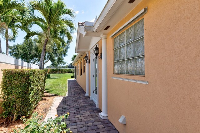 view of side of property with a yard