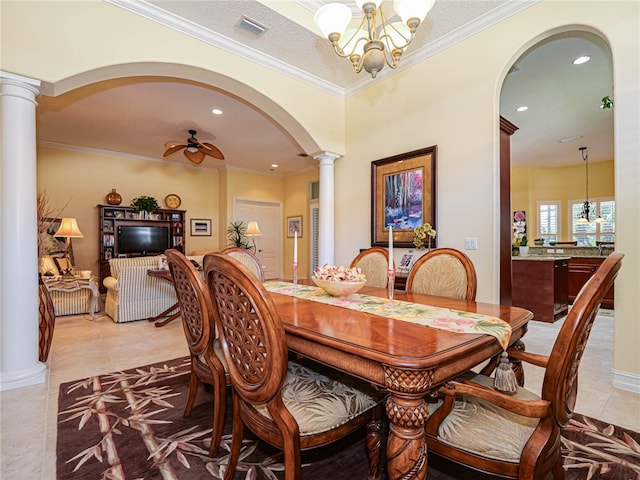 dining area with ornamental molding, light tile patterned floors, ornate columns, and ceiling fan with notable chandelier