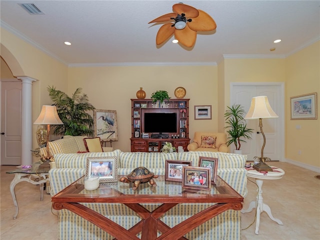 living room with ornamental molding, ceiling fan, and decorative columns