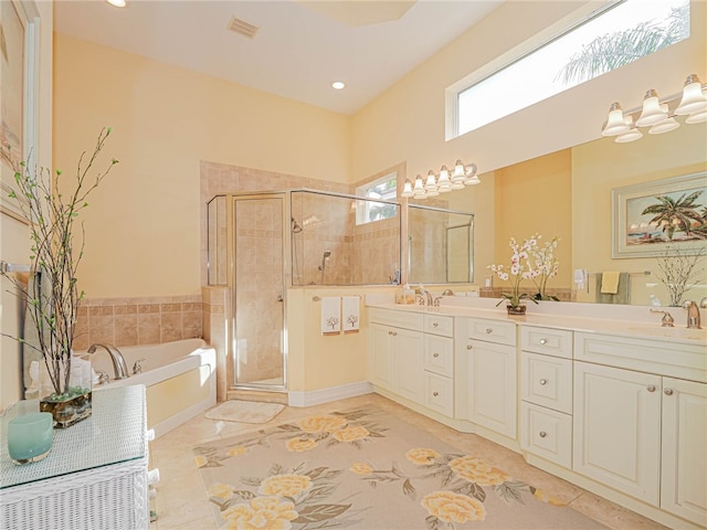 bathroom with vanity, tile patterned floors, and separate shower and tub