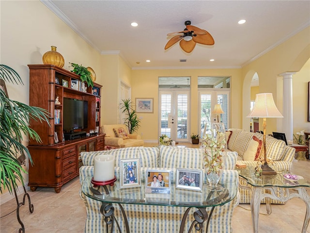 tiled living room with ornate columns, ornamental molding, and ceiling fan