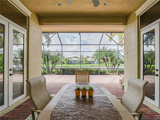 sunroom featuring a wealth of natural light and french doors