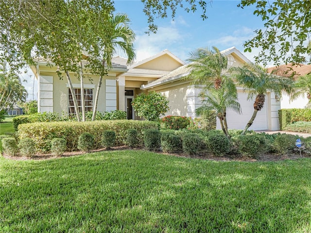 view of front facade with a front lawn and a garage