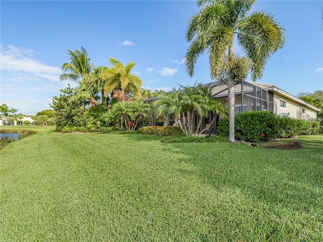 view of yard featuring a lanai