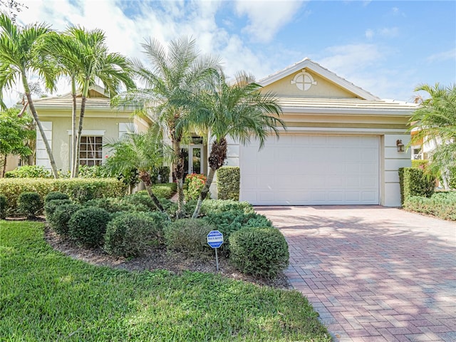 single story home featuring a garage