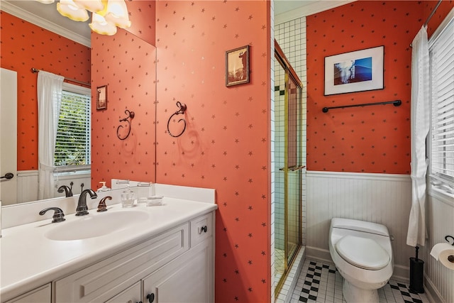 bathroom featuring vanity, tile patterned floors, crown molding, toilet, and an enclosed shower