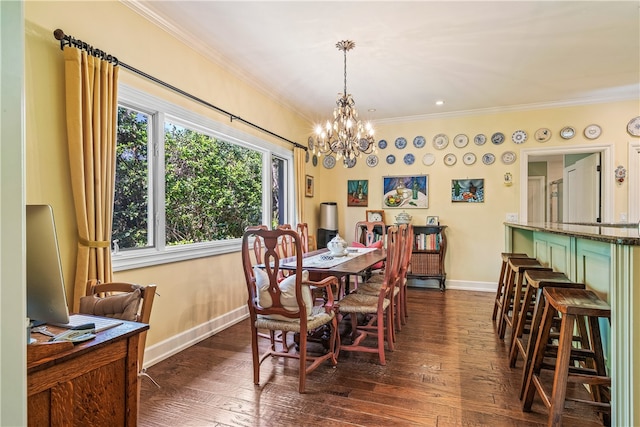 dining area with a notable chandelier, dark hardwood / wood-style floors, and crown molding