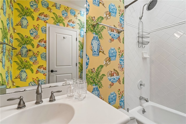 bathroom with sink and tiled shower / bath combo