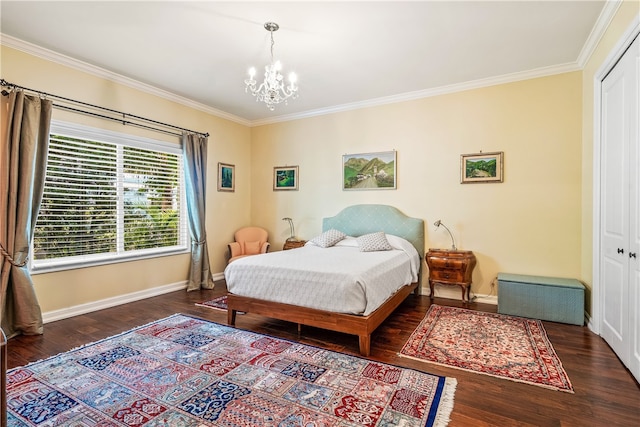 bedroom with a closet, dark wood-type flooring, a notable chandelier, and ornamental molding