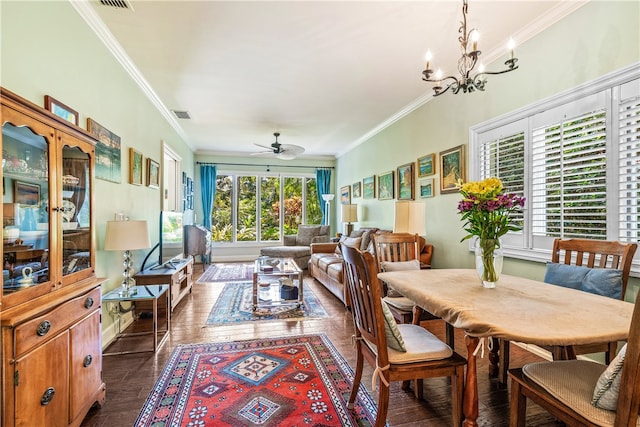 dining room featuring plenty of natural light, crown molding, ceiling fan with notable chandelier, and dark wood-type flooring