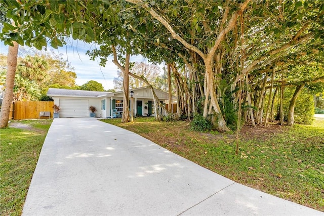 view of front of home featuring a garage and a front lawn