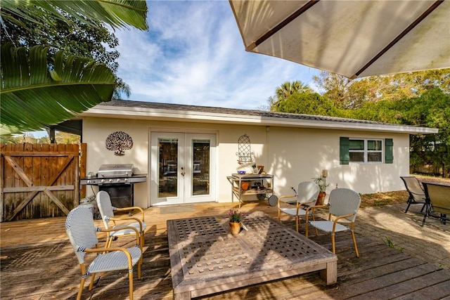 deck featuring french doors and area for grilling