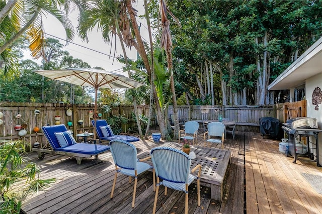 wooden deck featuring area for grilling