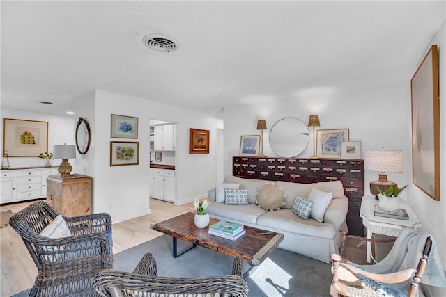 living room with light hardwood / wood-style floors