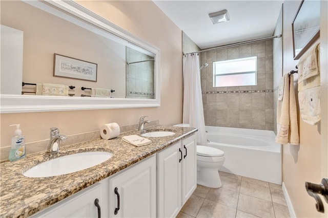 full bathroom with toilet, tile patterned flooring, vanity, and shower / tub combo with curtain