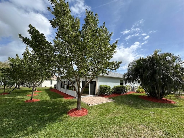 view of yard featuring a sunroom