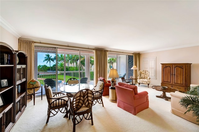 dining room with light carpet and ornamental molding