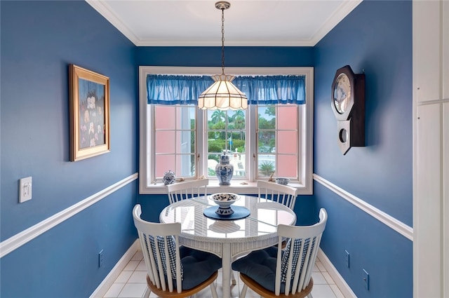 dining area featuring light tile patterned flooring and ornamental molding