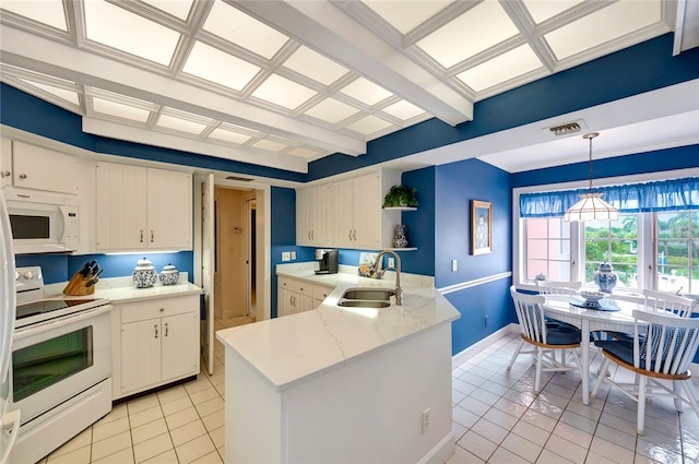 kitchen featuring light tile patterned flooring, decorative light fixtures, beam ceiling, sink, and white appliances