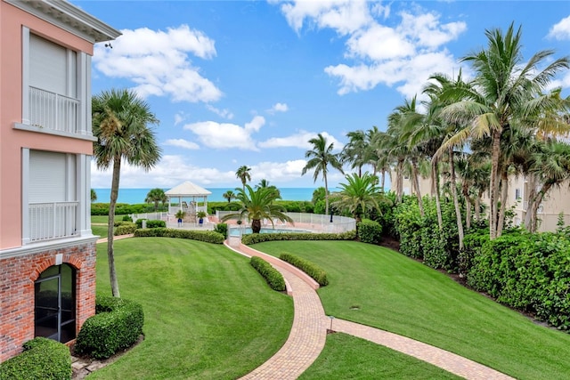 view of yard featuring a water view and a gazebo