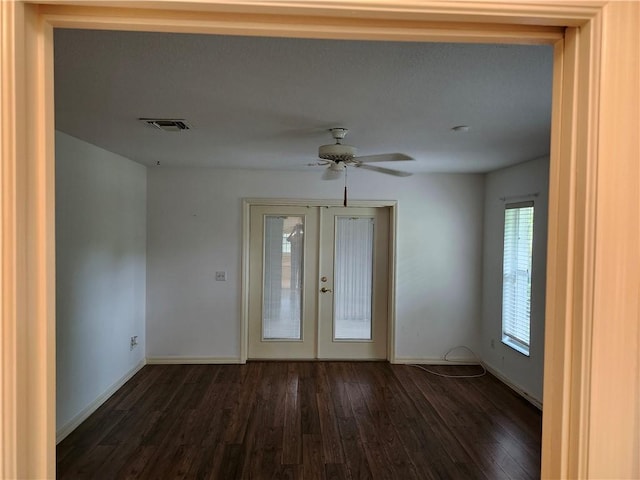 3865 8th Pl, Vero Beach, FL 32960 - spare room featuring dark wood-style flooring, french doors, and a ceiling fan