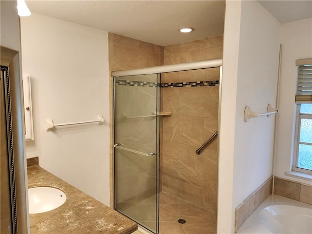 3865 8th Pl, Vero Beach, FL 32960 - bathroom featuring a shower stall, a garden tub, vanity, and recessed lighting