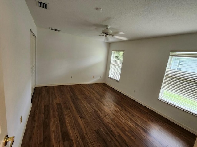 3865 8th Pl, Vero Beach, FL 32960 - empty room featuring a ceiling fan, dark wood-style floors, and a textured ceiling