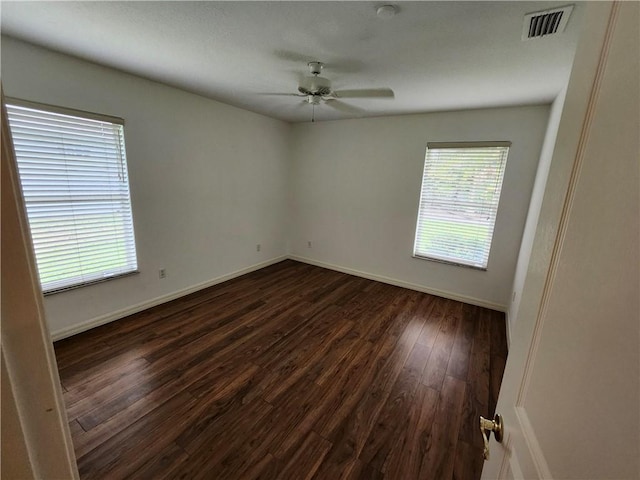3865 8th Pl, Vero Beach, FL 32960 - empty room with dark wood finished floors and a ceiling fan