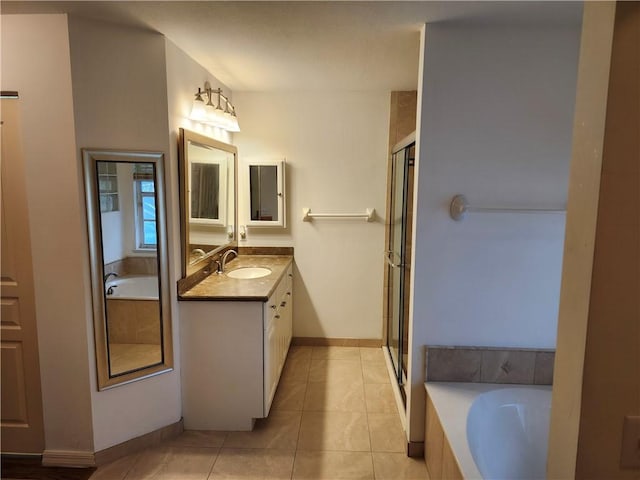 3865 8th Pl, Vero Beach, FL 32960 - bathroom with vanity, a bath, tile patterned flooring, and a stall shower