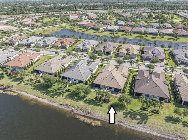 4348 Beauty Leaf Cir, Vero Beach, FL 32967 - drone / aerial view featuring a residential view and a water view