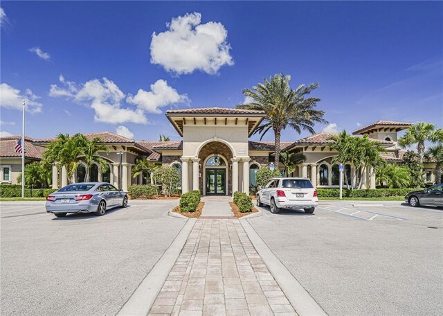 4348 Beauty Leaf Cir, Vero Beach, FL 32967 - view of building exterior featuring uncovered parking