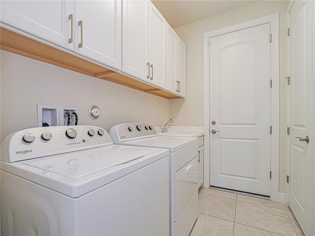 4348 Beauty Leaf Cir, Vero Beach, FL 32967 - laundry area with a sink, cabinet space, and washing machine and dryer