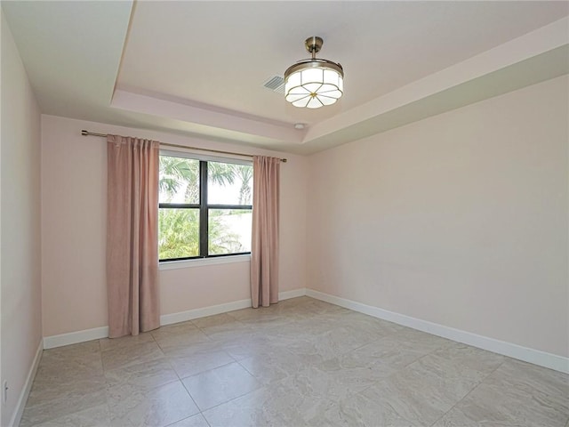4348 Beauty Leaf Cir, Vero Beach, FL 32967 - spare room featuring baseboards, visible vents, and a raised ceiling