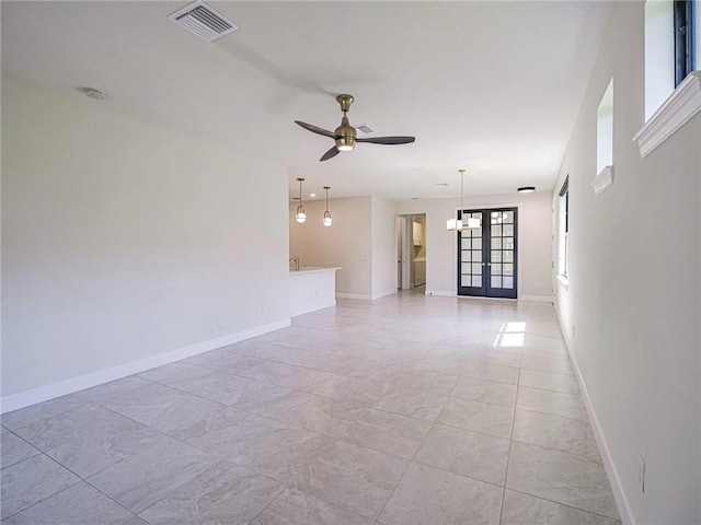 4348 Beauty Leaf Cir, Vero Beach, FL 32967 - unfurnished room featuring baseboards, visible vents, ceiling fan, and french doors