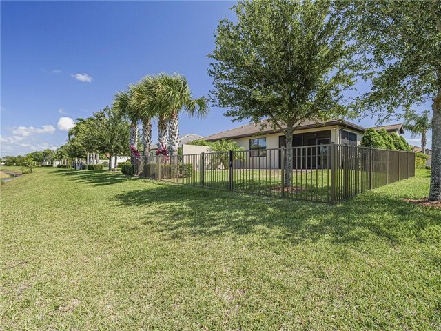 4348 Beauty Leaf Cir, Vero Beach, FL 32967 - view of yard featuring fence and a sunroom