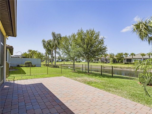 4348 Beauty Leaf Cir, Vero Beach, FL 32967 - view of patio / terrace with a water view and a fenced backyard