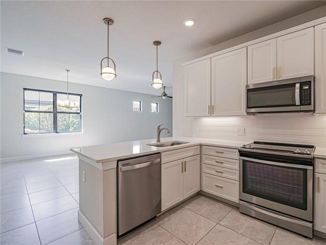 4348 Beauty Leaf Cir, Vero Beach, FL 32967 - kitchen featuring light tile patterned floors, appliances with stainless steel finishes, light countertops, and a sink