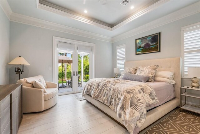 951 W Polo Grounds Dr, Vero Beach, FL 32966 - bedroom with multiple windows, access to exterior, a raised ceiling, crown molding, and french doors