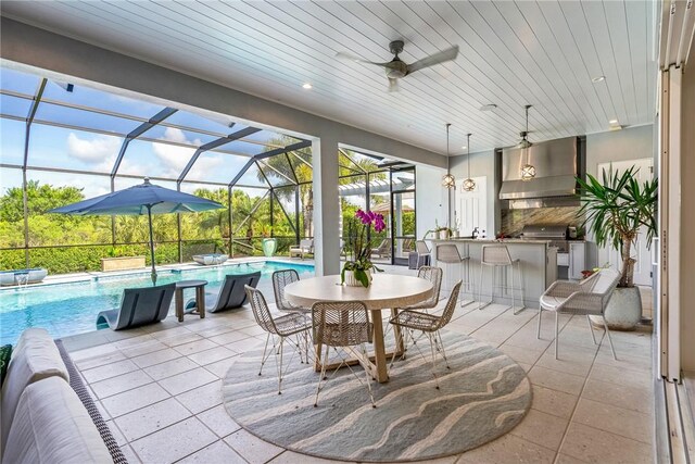 951 W Polo Grounds Dr, Vero Beach, FL 32966 - view of patio / terrace featuring an outdoor bar, area for grilling, an outdoor pool, a lanai, and ceiling fan