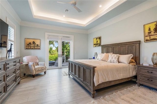 951 W Polo Grounds Dr, Vero Beach, FL 32966 - bedroom with access to exterior, french doors, a tray ceiling, light wood-type flooring, and crown molding