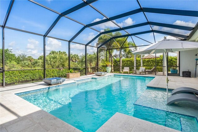 951 W Polo Grounds Dr, Vero Beach, FL 32966 - swimming pool with a patio area and a lanai