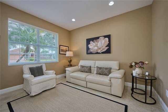 1110 Southlakes Way SW, Vero Beach, FL 32968 - tiled living room featuring baseboards and recessed lighting
